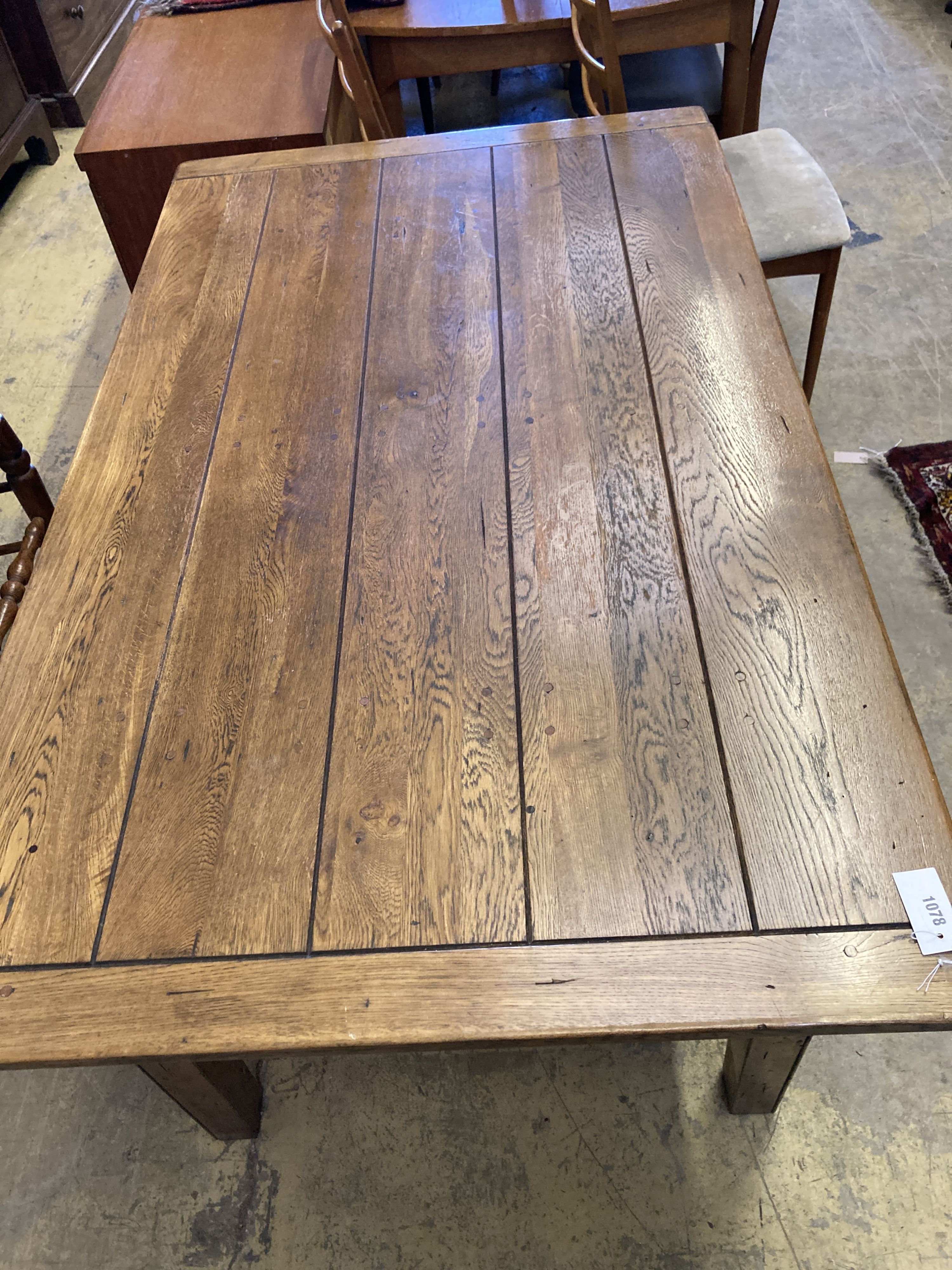 A 19th century style rectangular oak dining table with planked top, length 153cm, depth 90cm, height 77cm